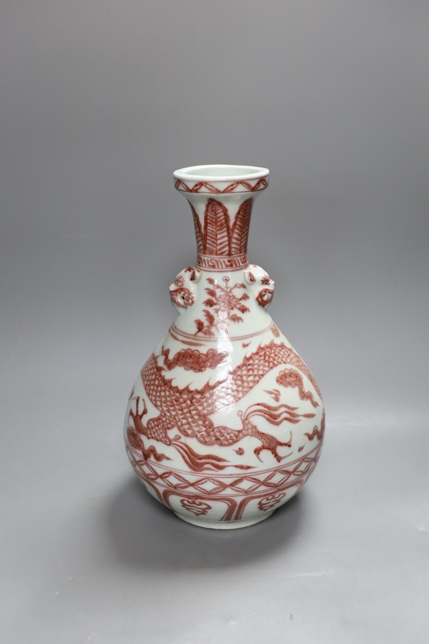 A Chinese vase with dragon decoration in underglaze copper, 35cm
